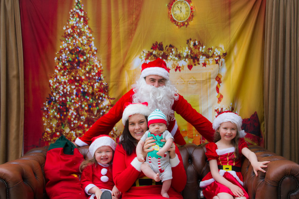 The Claus family and a baby elf